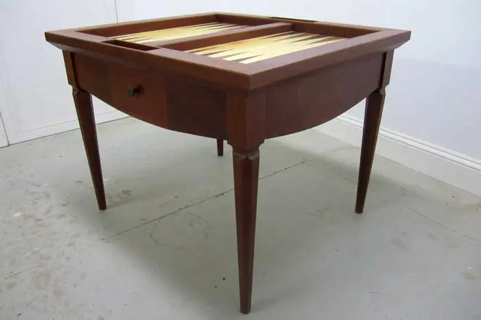 Wooden table with backgammon board top.