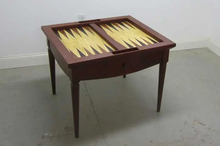 Wooden table with built-in backgammon board.