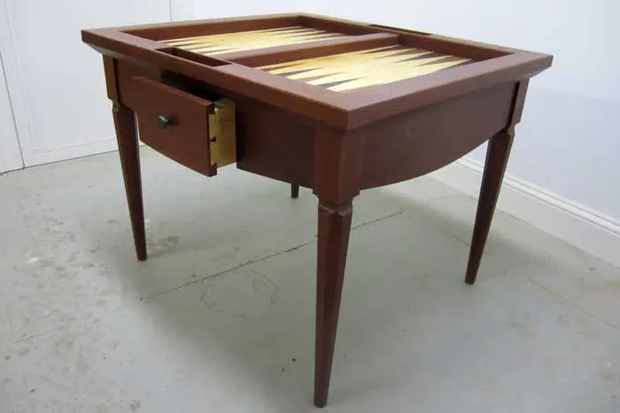 Wooden table with built-in backgammon board.