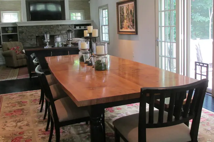 Dining room with wooden table and chairs.