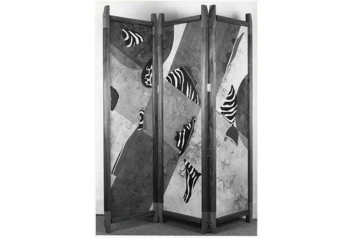 Folding screen with abstract zebra design.