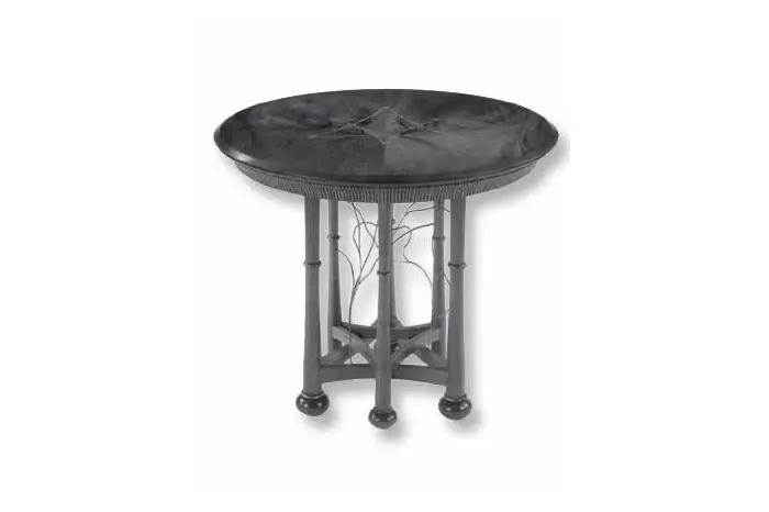 Round black table with decorative legs.