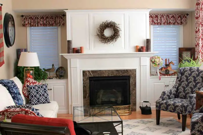 Cozy living room with decorated fireplace.