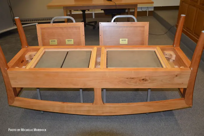Wooden table upside down in a classroom.